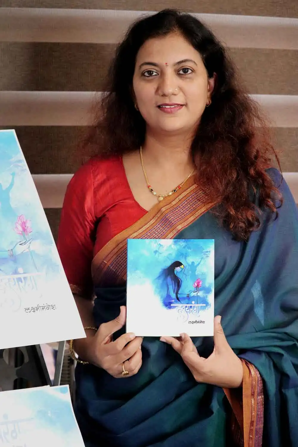 Vijayalaxmi Manerikar with her book Hrydarang